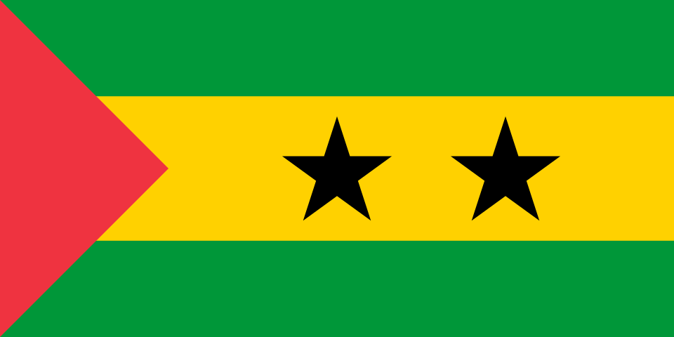 A flag with two yellow triangles at the top and bottom and two green triangles at the hoist and fly. These are surrounded by a red border charged with six five-pointed yellow stars – three at the top centre and three at the bottom centre – along with an additional star on a red disc at the centre and a nutmeg at the hoist triangle